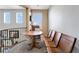 Cozy upstairs reading nook featuring a round wooden table and 3 wooden chairs at 7778 Villa Montara St, Las Vegas, NV 89123