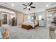 Large main bedroom featuring a four-poster bed, a walk-in closet, and sitting area at 7778 Villa Montara St, Las Vegas, NV 89123