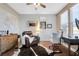 Comfortable home office area featuring hardwood flooring, a world map, and a brown leather recliner at 7778 Villa Montara St, Las Vegas, NV 89123