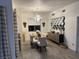 Contemporary dining room with a glass table, stylish chairs, modern lighting, and unique wall decor at 8255 Las Vegas Blvd # 611, Las Vegas, NV 89123