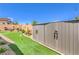 Charming backyard with putting green, storage shed, and ample space for outdoor activities at 8269 Skye Peak St, Las Vegas, NV 89166