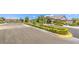 Welcoming entrance to a well-maintained community with manicured landscaping and a secure gate at 8269 Skye Peak St, Las Vegas, NV 89166