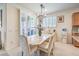 Dining area features natural lighting, stylish chandelier, and comfortable seating at 8269 Skye Peak St, Las Vegas, NV 89166