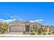 Charming single-story home featuring a well-maintained front yard, desert landscaping, and an attached two-car garage at 8269 Skye Peak St, Las Vegas, NV 89166