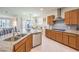 The kitchen offers tile backsplash, stainless appliances, and bright light throughout at 8269 Skye Peak St, Las Vegas, NV 89166