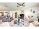 Well-appointed living room with plush seating, accent furniture, modern decor, and a stylish ceiling fan for a cool, comfortable ambiance at 8269 Skye Peak St, Las Vegas, NV 89166