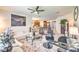 Spacious living area with plush seating, decorative accents, ample room for entertaining, and flowing into the kitchen at 8269 Skye Peak St, Las Vegas, NV 89166