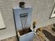 Modern water feature with rusted reservoir and stacked stone accents at 8269 Skye Peak St, Las Vegas, NV 89166