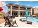 Luxurious backyard with a pool, patio, and spiral staircase for outdoor living at 8275 Old Creek Ranch St, Las Vegas, NV 89139