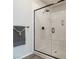 This modern bathroom features a glass-enclosed shower with marble surround at 8275 Old Creek Ranch St, Las Vegas, NV 89139