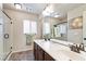 Clean bathroom features a walk-in shower, dual sinks, and dark wood cabinetry at 8275 Old Creek Ranch St, Las Vegas, NV 89139