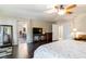 Bright bedroom with hardwood floors, a king-size bed, and an en-suite bathroom, offering a private retreat at 8275 Old Creek Ranch St, Las Vegas, NV 89139