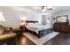 Well-lit bedroom with a comfortable king-size bed, stylish furniture, and a relaxing ambiance at 8275 Old Creek Ranch St, Las Vegas, NV 89139
