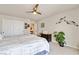 Comfortable bedroom features a queen bed, ceiling fan, and a large closet at 8275 Old Creek Ranch St, Las Vegas, NV 89139