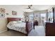 Charming bedroom with a queen bed, dresser, and windows at 8275 Old Creek Ranch St, Las Vegas, NV 89139
