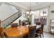 Bright dining room with staircase access and large windows with backyard views at 8275 Old Creek Ranch St, Las Vegas, NV 89139
