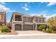 Elegant two-story home featuring a three-car garage and landscaped front yard at 8275 Old Creek Ranch St, Las Vegas, NV 89139