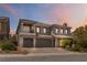 An elegant two-story home featuring a three-car garage, well-maintained landscaping, and a welcoming facade at 8275 Old Creek Ranch St, Las Vegas, NV 89139