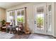 Bright foyer with elegant tile flooring and a decorative glass door and sidelights at 8275 Old Creek Ranch St, Las Vegas, NV 89139