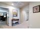 Hallway featuring a decorative table with view into an office at 8275 Old Creek Ranch St, Las Vegas, NV 89139