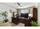 Inviting home office features a ceiling fan, desk, and built-in shelving at 8275 Old Creek Ranch St, Las Vegas, NV 89139