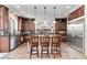 A lovely kitchen featuring a spacious island with barstool seating and stainless steel appliances at 8275 Old Creek Ranch St, Las Vegas, NV 89139