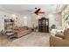 Bright living room with plush seating, large windows, and decorative accents at 8275 Old Creek Ranch St, Las Vegas, NV 89139
