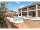 A luxurious backyard features a stunning pool and spa, perfect for relaxation and entertaining guests at 8275 Old Creek Ranch St, Las Vegas, NV 89139