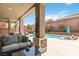 Inviting outdoor space with swimming pool, lounge chairs, and patio seating at 8275 Old Creek Ranch St, Las Vegas, NV 89139