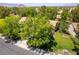 Single-story home featuring lush, mature landscaping and a well-maintained lawn in a residential neighborhood at 8516 Millsboro Dr, Las Vegas, NV 89134