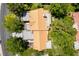 Aerial shot of a home showing the tile roof, flat roof portions, and mature surrounding trees at 8516 Millsboro Dr, Las Vegas, NV 89134