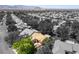 Aerial view of home displaying outdoor patio with mature landscaping; mountains in the background at 8516 Millsboro Dr, Las Vegas, NV 89134