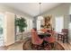 Cozy dining room features stylish chairs, shutters and natural light for a relaxing setting at 8516 Millsboro Dr, Las Vegas, NV 89134
