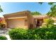 Beautiful, one-story house featuring a well-manicured lawn and an attached two-car garage at 8516 Millsboro Dr, Las Vegas, NV 89134