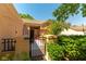 Charming front entrance with a well-maintained garden and a secured front gate at 8516 Millsboro Dr, Las Vegas, NV 89134