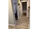 Bright hallway featuring hardwood flooring and leading to bedrooms and living areas at 8516 Millsboro Dr, Las Vegas, NV 89134