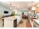 Spacious kitchen featuring a large granite island with seating, stainless steel appliances at 8516 Millsboro Dr, Las Vegas, NV 89134