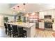 Spacious kitchen with large island, granite countertops, stainless steel appliances, and pendant lighting at 8516 Millsboro Dr, Las Vegas, NV 89134