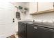 Well-lit laundry room featuring new Maytag washer and dryer and storage space at 8516 Millsboro Dr, Las Vegas, NV 89134