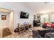 Inviting living room features modern entertainment center, neutral tones, piano and ample natural light at 8516 Millsboro Dr, Las Vegas, NV 89134