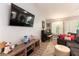 Cozy living room featuring a wall-mounted TV and decorative items on the console at 8516 Millsboro Dr, Las Vegas, NV 89134