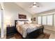 Cozy main bedroom with natural light, hardwood floors, and stylish furnishings at 8516 Millsboro Dr, Las Vegas, NV 89134