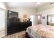 Spacious main bedroom with large windows, dresser and comfortable bed at 8516 Millsboro Dr, Las Vegas, NV 89134