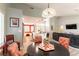 Open-concept space with breakfast nook, granite island, and seamless flow to the living area at 8516 Millsboro Dr, Las Vegas, NV 89134