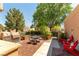 Outdoor brick patio featuring a grill, dining set, and comfortable seating perfect for entertaining at 8516 Millsboro Dr, Las Vegas, NV 89134