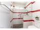 Modern shower with textured walls, glass doors, and red accent stripes at 8516 Millsboro Dr, Las Vegas, NV 89134