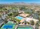 Community clubhouse with pool, tennis courts, and lush landscaping at 8629 Prairie Hill Dr, Las Vegas, NV 89134