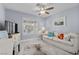 Bedroom with neutral tones featuring a comfortable sofa and bright decor at 8629 Prairie Hill Dr, Las Vegas, NV 89134