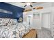 Bright bedroom with beach theme decor, open ceiling, and plenty of storage above the doorway at 8629 Prairie Hill Dr, Las Vegas, NV 89134
