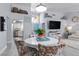 Open-concept dining area featuring stylish chairs, modern decor, and connection to the kitchen at 8629 Prairie Hill Dr, Las Vegas, NV 89134